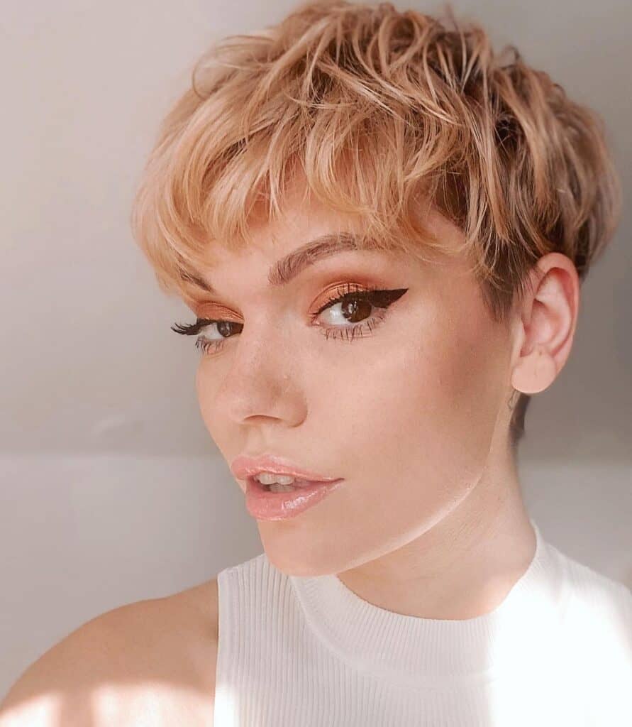 Strawberry blonde pixie cut