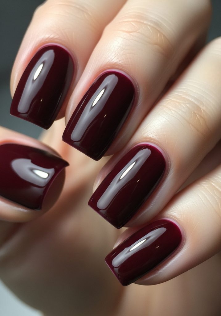 All ten nails in classic glossy burgundy with a rich high-shine finish