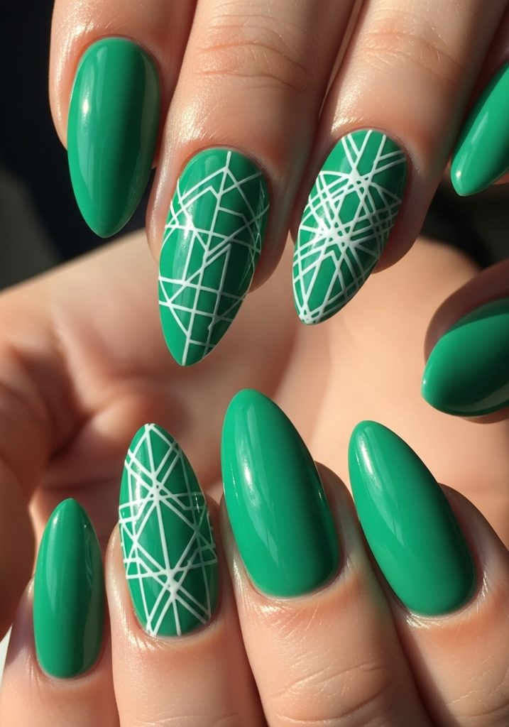 Jade nails with white geometric line designs on accent fingers, glossy finish