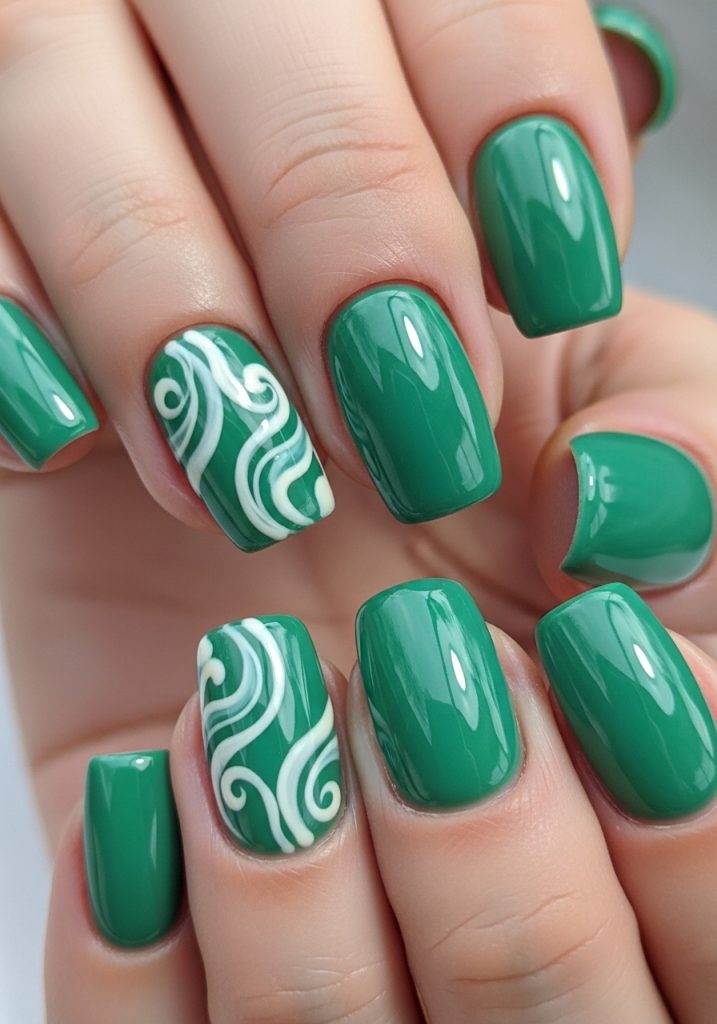 Jade green accent nails with white swirl art design and glossy finish