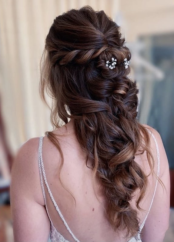 Messy half-up bridal hairstyle with braids