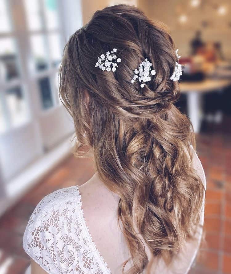 Half-up hairstyle with floral touches