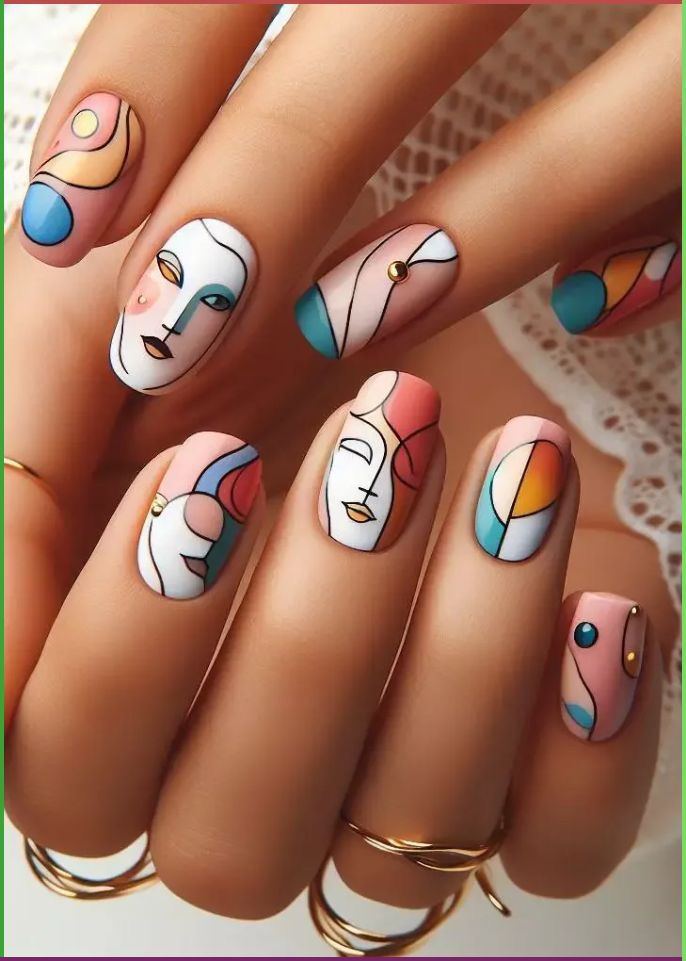 Close-up of hands with nails painted light pink, featuring cubist faces and abstract shapes in pastel colors with black outli