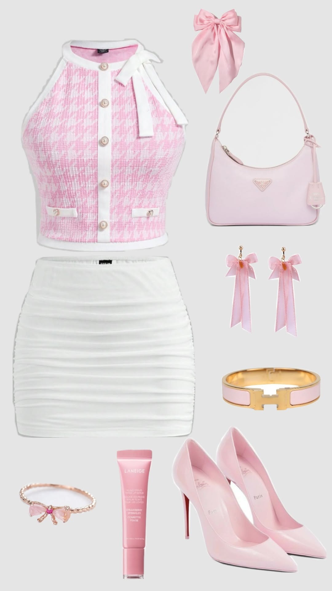 A flat lay of a pink and white houndstooth halter top, a ruched white mini skirt, light pink heels, a pink shoulder bag, and
